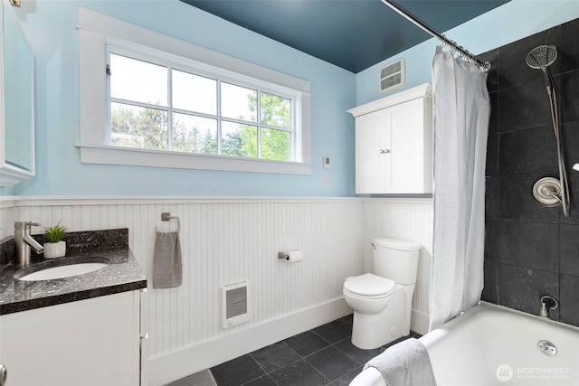 832 Willow St, Port Townsend, WA 98368 - bathroom with vanity, a wainscoted wall, tile patterned floors, shower / tub combo, and heating unit