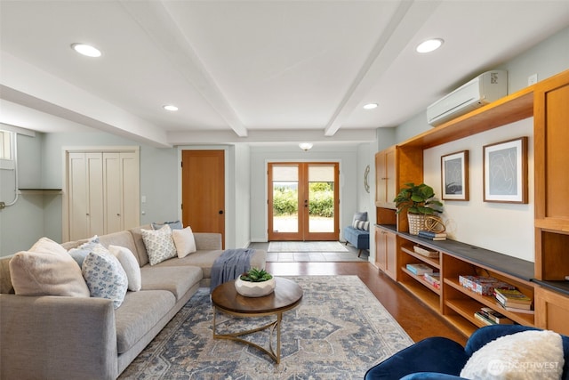832 Willow St, Port Townsend, WA 98368 - living room with an AC wall unit, beamed ceiling, french doors, recessed lighting, and wood finished floors