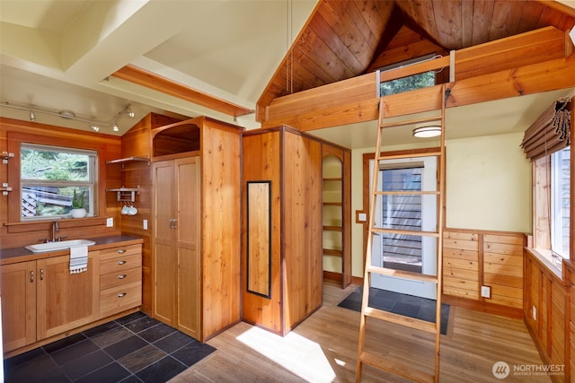 832 Willow St, Port Townsend, WA 98368 - kitchen with lofted ceiling, wooden walls, and track lighting