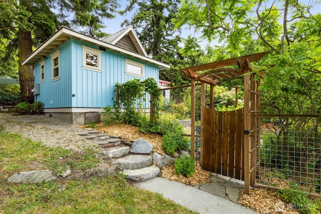 832 Willow St, Port Townsend, WA 98368 - view of side of property featuring board and batten siding and a gate