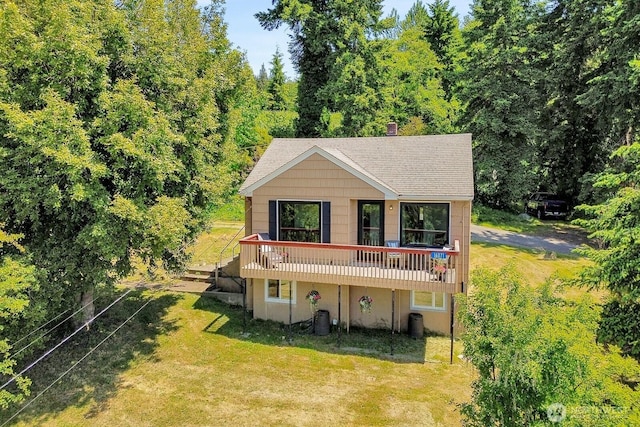 16071 Colony Rd, Bow, WA 98232 - view of front of property with a front lawn, a wooden deck, a shingled roof, and a chimney