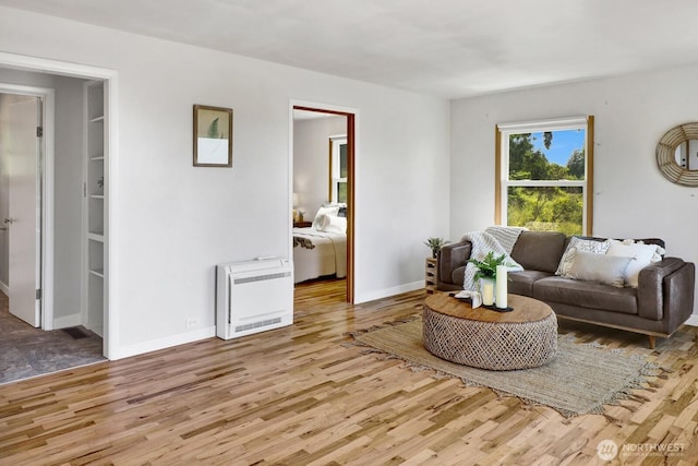 16071 Colony Rd, Bow, WA 98232 - living area featuring heating unit and wood finished floors