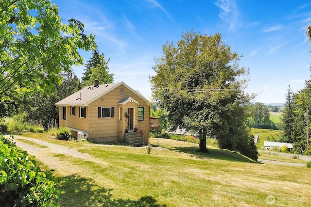 16071 Colony Rd, Bow, WA 98232 - view of front of home with a front yard and a chimney