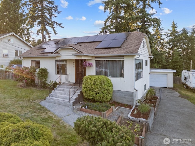 2319 Gale Pl, Everett, WA 98203 - bungalow-style home with a shingled roof, driveway, roof mounted solar panels, and an outbuilding