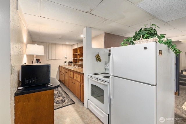 2319 Gale Pl, Everett, WA 98203 - kitchen with white appliances, a drop ceiling, and brown cabinetry
