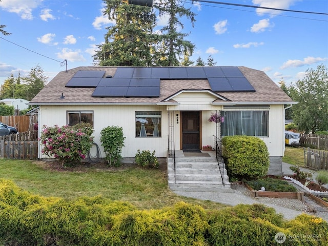 2319 Gale Pl, Everett, WA 98203 - view of front facade with a shingled roof, solar panels, and a garden