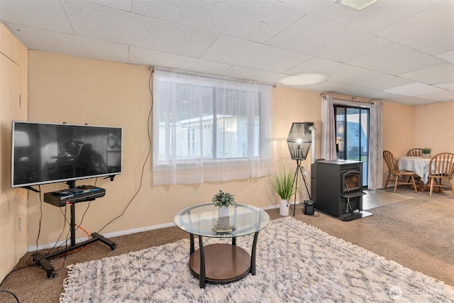 2319 Gale Pl, Everett, WA 98203 - living area with a wood stove, carpet floors, and a drop ceiling