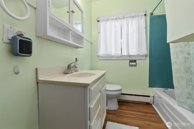 2319 Gale Pl, Everett, WA 98203 - full bathroom with baseboard heating, vanity, wood finished floors, and shower / bath combination with curtain