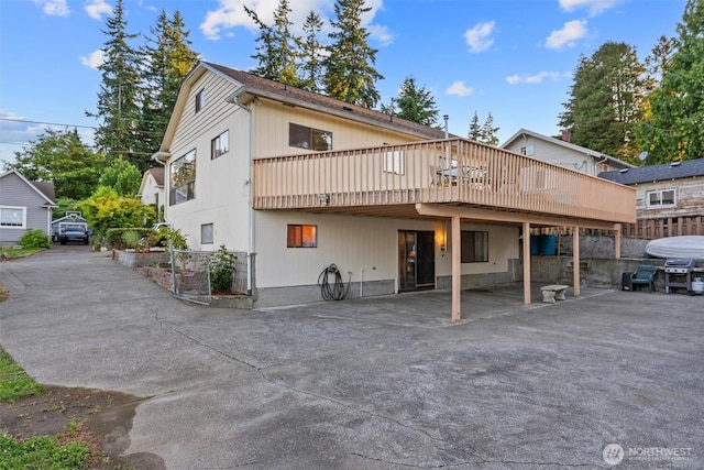2319 Gale Pl, Everett, WA 98203 - back of house with a wooden deck, a carport, and driveway