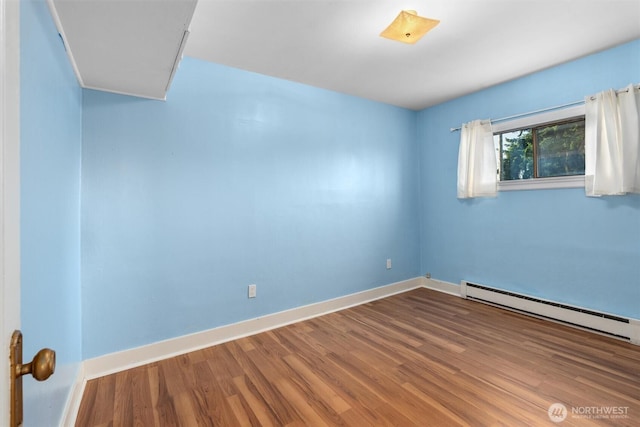 2319 Gale Pl, Everett, WA 98203 - unfurnished room featuring wood finished floors and baseboard heating