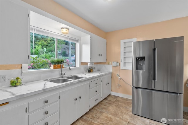 2319 Gale Pl, Everett, WA 98203 - kitchen featuring stainless steel refrigerator with ice dispenser, white cabinets, and light stone countertops