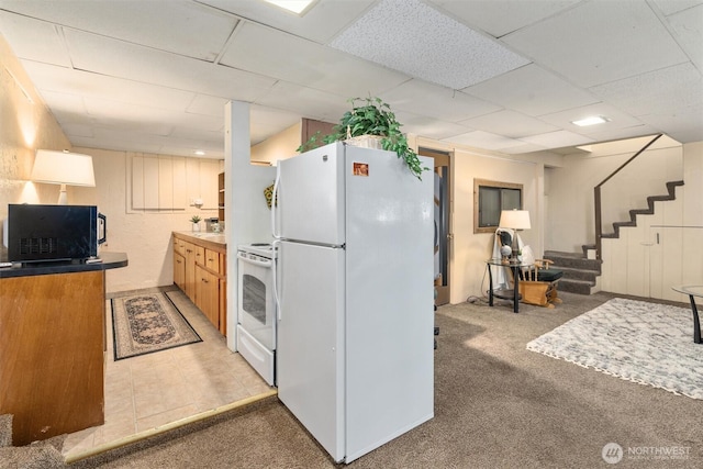 2319 Gale Pl, Everett, WA 98203 - kitchen with white appliances, a paneled ceiling, and light carpet