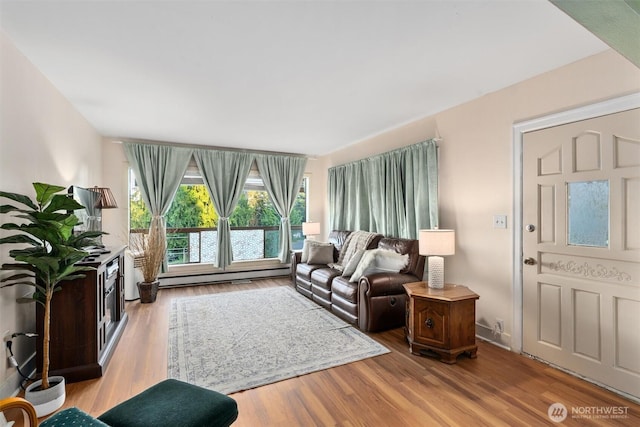 2319 Gale Pl, Everett, WA 98203 - living area with a baseboard radiator and wood finished floors