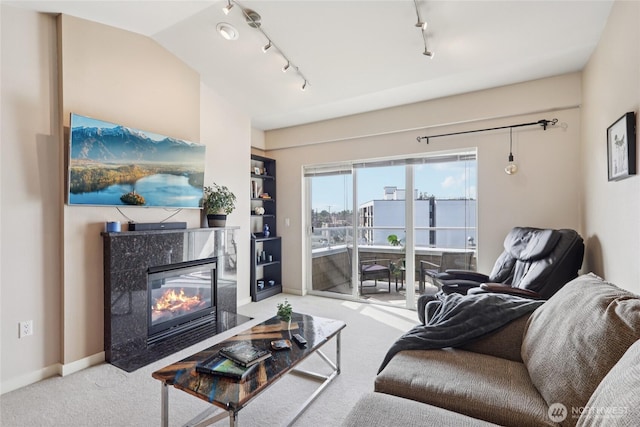 1 Broadway Unit 721, Tacoma, WA 98402 - living area featuring carpet floors, rail lighting, and a premium fireplace