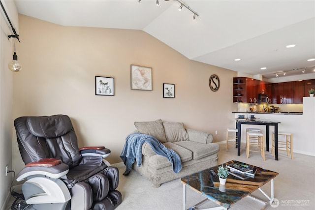 1 Broadway Unit 721, Tacoma, WA 98402 - carpeted living area with lofted ceiling and track lighting