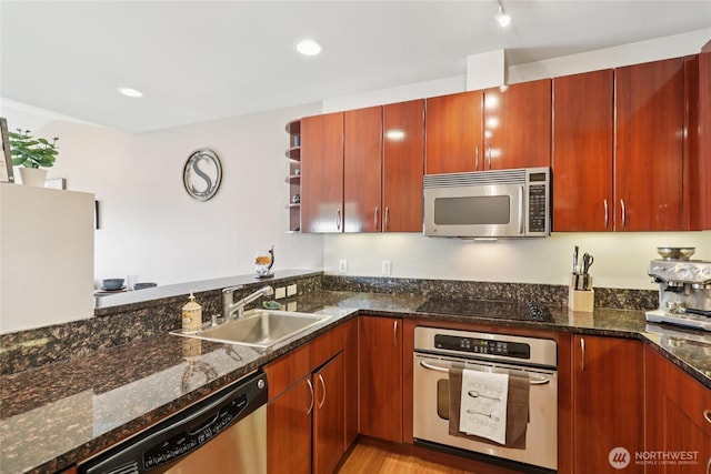 1 Broadway Unit 721, Tacoma, WA 98402 - kitchen with stainless steel appliances, open shelves, dark stone counters, light wood-style floors, and recessed lighting