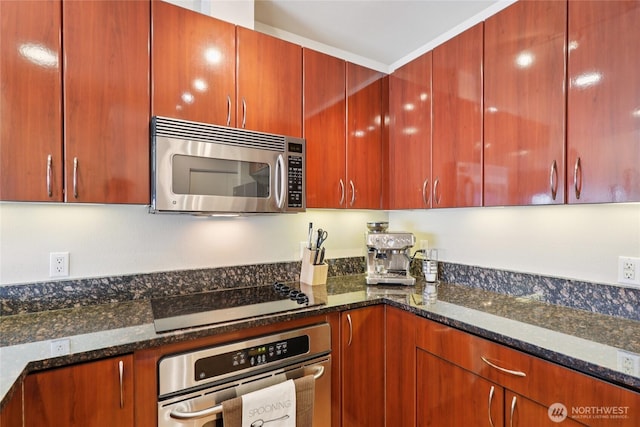 1 Broadway Unit 721, Tacoma, WA 98402 - kitchen with stainless steel appliances, dark stone countertops, and modern cabinets