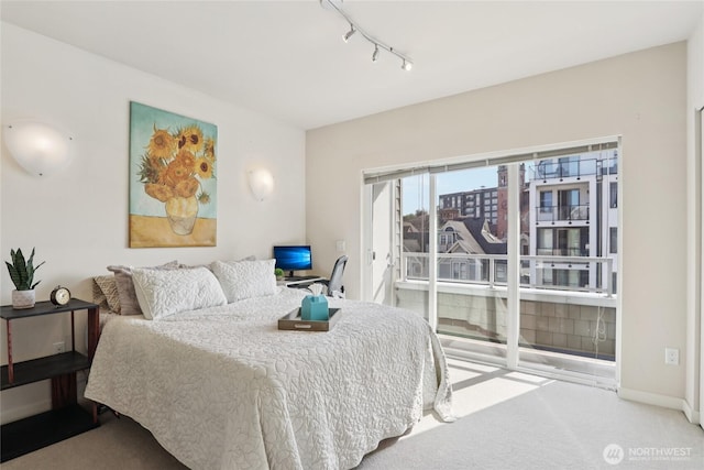 1 Broadway Unit 721, Tacoma, WA 98402 - bedroom featuring track lighting, carpet floors, and a desk