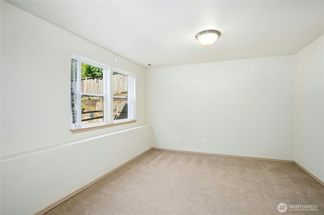 6205 26th St NE, Tacoma, WA 98422 - unfurnished room with light colored carpet and baseboards