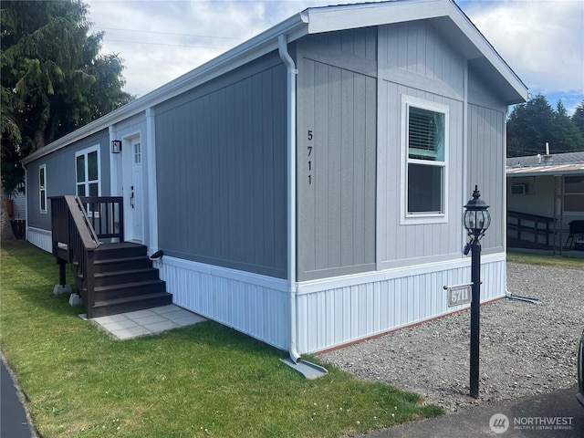 5711 112th Avenue Ct E Unit 30, Puyallup, WA 98372 - view of side of home featuring a yard
