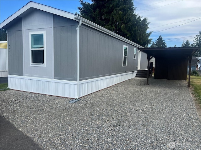 5711 112th Avenue Ct E Unit 30, Puyallup, WA 98372 - view of home's exterior with driveway and a carport