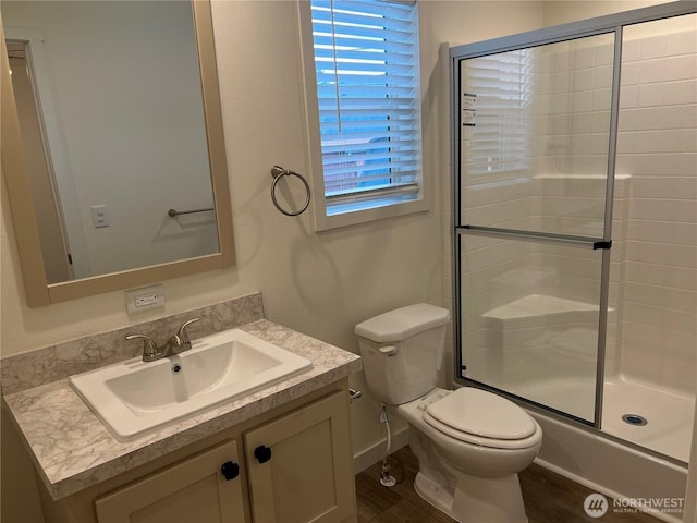 5711 112th Avenue Ct E Unit 30, Puyallup, WA 98372 - full bathroom featuring vanity, an enclosed shower, and wood finished floors