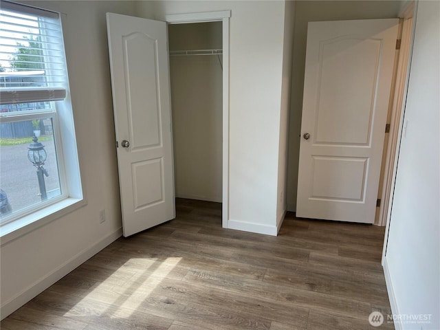 5711 112th Avenue Ct E Unit 30, Puyallup, WA 98372 - unfurnished bedroom featuring wood finished floors and a closet