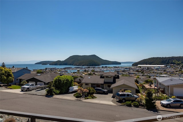 1807 Bradley Dr, Anacortes, WA 98221 - view of mountain backdrop featuring a nearby body of water and nearby suburban area