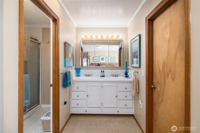 1807 Bradley Dr, Anacortes, WA 98221 - bathroom with ornamental molding, a stall shower, double vanity, and tile patterned floors