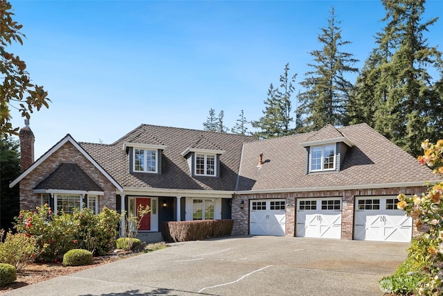 413 213th Pl SE, Sammamish, WA 98074 - view of front of home with an attached garage, concrete driveway, a chimney, and roof with shingles