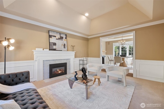 413 213th Pl SE, Sammamish, WA 98074 - living area featuring carpet, a chandelier, a wainscoted wall, a fireplace, and a decorative wall