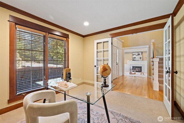 413 213th Pl SE, Sammamish, WA 98074 - office area with french doors, crown molding, a glass covered fireplace, carpet floors, and recessed lighting