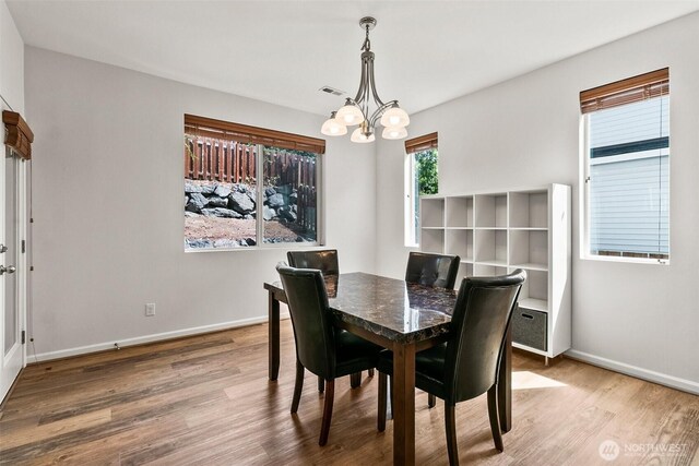 21552 SE 275th Ct, Maple Valley, WA 98038 - dining room with a chandelier and wood finished floors