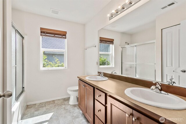 21552 SE 275th Ct, Maple Valley, WA 98038 - bathroom featuring double vanity and bath / shower combo with glass door