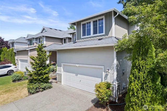 21552 SE 275th Ct, Maple Valley, WA 98038 - view of property exterior with a garage, board and batten siding, and driveway