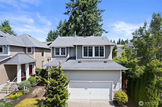 21552 SE 275th Ct, Maple Valley, WA 98038 - view of front of house with an attached garage, board and batten siding, and concrete driveway