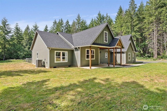 809 NW Gertrude Ave, Winlock, WA 98596 - back of house featuring a patio, board and batten siding, a yard, and crawl space