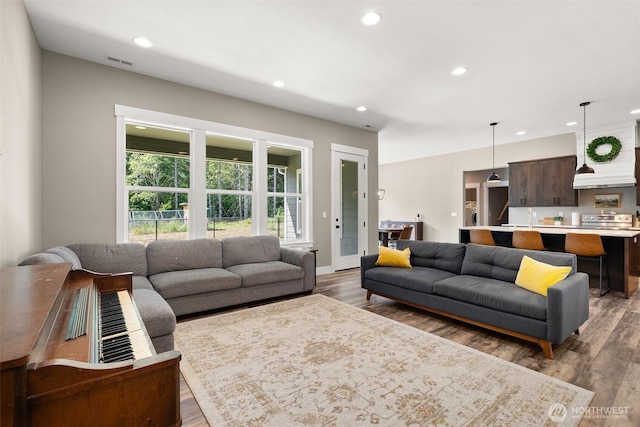 809 NW Gertrude Ave, Winlock, WA 98596 - living room featuring wood finished floors and recessed lighting