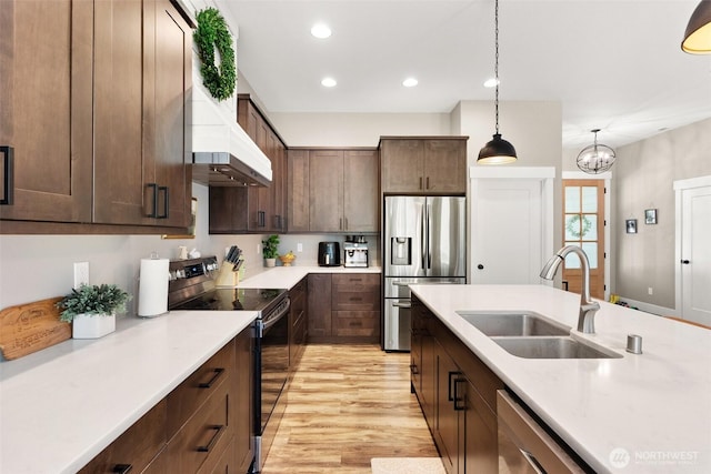 809 NW Gertrude Ave, Winlock, WA 98596 - kitchen featuring stainless steel appliances, light countertops, dark brown cabinets, and recessed lighting