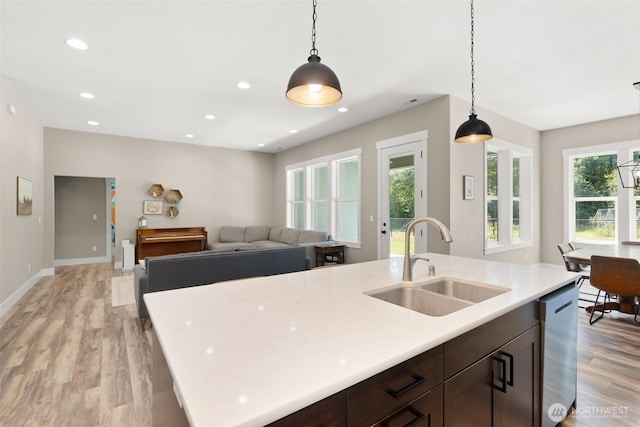 809 NW Gertrude Ave, Winlock, WA 98596 - kitchen with dishwasher, light wood-style floors, plenty of natural light, light countertops, and recessed lighting