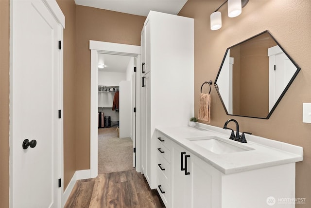 809 NW Gertrude Ave, Winlock, WA 98596 - bathroom featuring vanity and wood finished floors