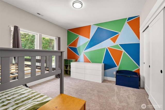 809 NW Gertrude Ave, Winlock, WA 98596 - bedroom featuring carpet floors, a closet, and an accent wall