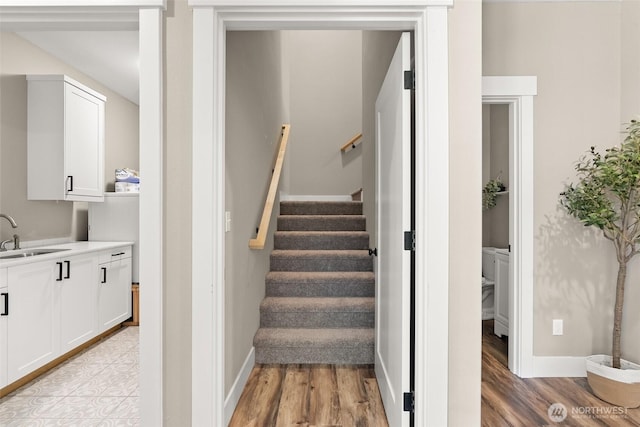 809 NW Gertrude Ave, Winlock, WA 98596 - staircase with wood finished floors and baseboards