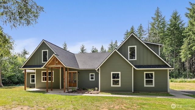 809 NW Gertrude Ave, Winlock, WA 98596 - view of front of home with board and batten siding, a front lawn, and roof with shingles