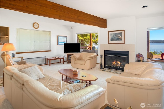 160 Wildwood Shrs, Brinnon, WA 98320 - living area featuring a tile fireplace, carpet, and beamed ceiling