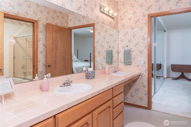 160 Wildwood Shrs, Brinnon, WA 98320 - bathroom featuring connected bathroom, double vanity, and wallpapered walls