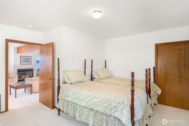 160 Wildwood Shrs, Brinnon, WA 98320 - carpeted bedroom featuring a tile fireplace