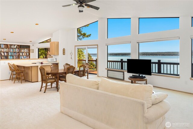 160 Wildwood Shrs, Brinnon, WA 98320 - living area featuring light carpet, a ceiling fan, and high vaulted ceiling