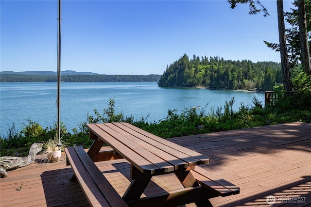 160 Wildwood Shrs, Brinnon, WA 98320 - wooden terrace with a water and mountain view and a view of trees