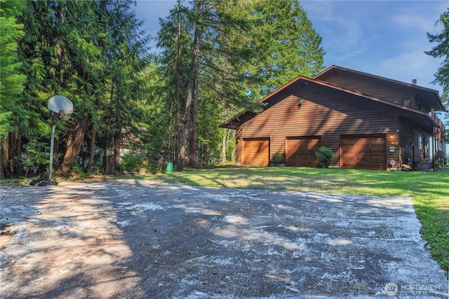 160 Wildwood Shrs, Brinnon, WA 98320 - view of side of property featuring driveway and a yard
